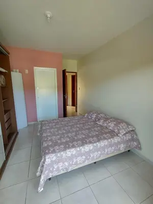 Uma cama ou camas num quarto em Apto Alecrim