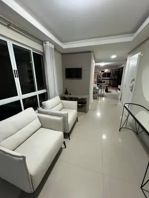 Uma área de estar em Duplex Alto Padrão com Vista Mar