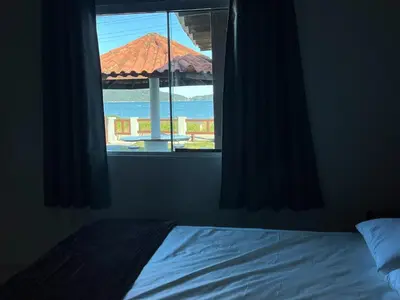Uma cama ou camas num quarto em Casa Tempo e Mar - A Beira da Praia de Zimbros
