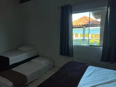 Uma cama ou camas num quarto em Casa Tempo e Mar - A Beira da Praia de Zimbros
