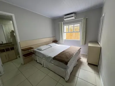 Uma cama ou camas num quarto em Casa Concha 300m Praia de Bombas