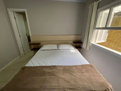 Uma cama ou camas num quarto em Casa Concha 300m Praia de Bombas