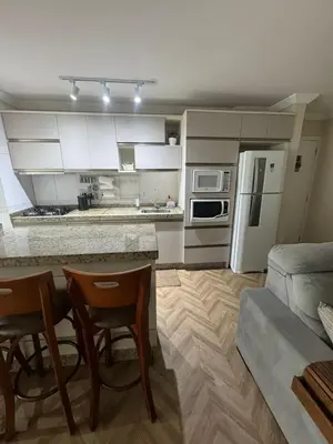 A cozinha ou kitchenette de Apartamento na Praia do Perequê