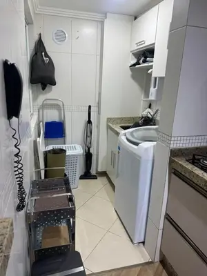 A cozinha ou kitchenette de Apartamento na Praia do Perequê