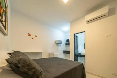 Uma cama ou camas num quarto em Studio Mar Bombinhas