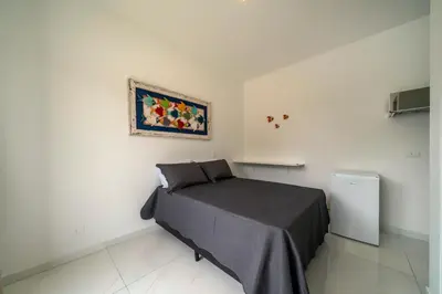 Uma cama ou camas num quarto em Studio Mar Bombinhas