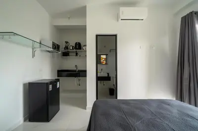 Uma cama ou camas num quarto em Studio Mar Bombinhas