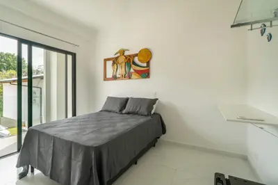 Uma cama ou camas num quarto em Studio Mar Bombinhas