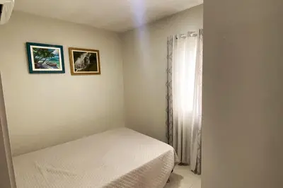 Uma cama ou camas num quarto em Apartamento com Ar Condicionado nos dois quartos