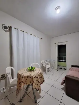 Uma área de estar em Apartamento Verde Mar