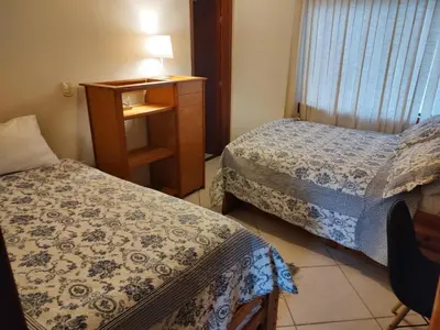 Uma cama ou camas num quarto em Solar Grace casa 02