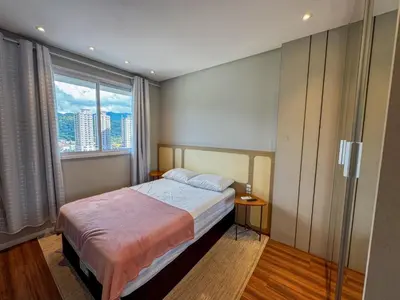 Uma cama ou camas num quarto em Apartmento luxo Itapema SC