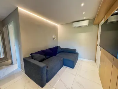 Uma área de estar em Apartmento luxo Itapema SC