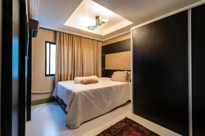 Uma cama ou camas num quarto em Apartamento Barra Sul Frente Mar