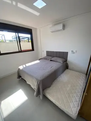 Uma cama ou camas num quarto em Apto Jacuzzi Pool HomeClub