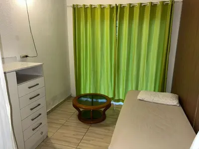 Uma cama ou camas num quarto em Casa Perequê
