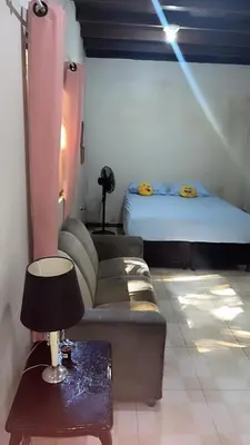 Uma cama ou camas num quarto em Quarto ECONÔMICO - Suíte