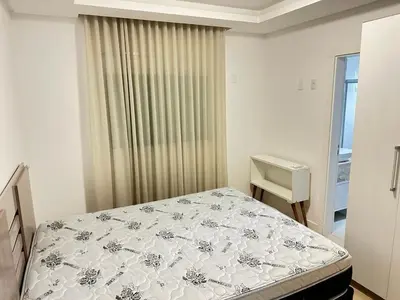 Uma cama ou camas num quarto em Apartment Meia Praia 3 Suites