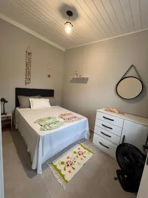 Uma cama ou camas num quarto em Casa de Praia 63 - Nelson