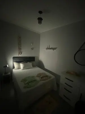 Uma cama ou camas num quarto em Casa de Praia 63 - Nelson