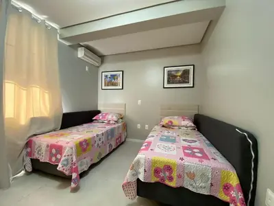 Uma cama ou camas num quarto em Praia de Palmas - Excelente apartamento
