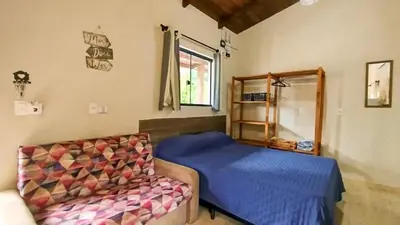 Uma cama ou camas num quarto em ROD_02 Monoambiente confotable para parejas