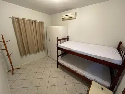 Uma cama ou camas num quarto em Casa na Praia de Palmas - 400 metros da praia