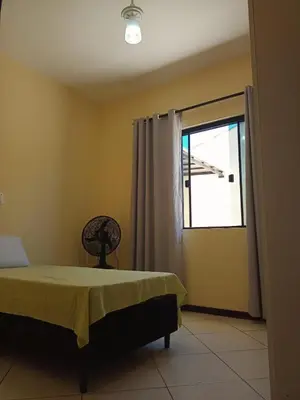 Uma cama ou camas num quarto em Linda casa