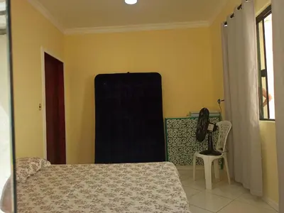 Uma cama ou camas num quarto em Linda casa