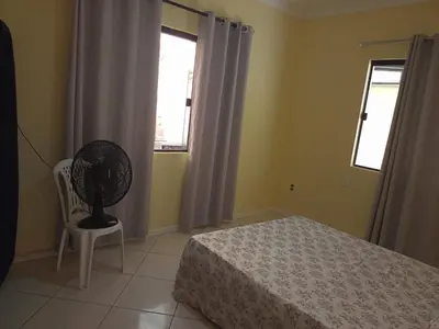 Uma cama ou camas num quarto em Linda casa