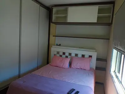 Uma cama ou camas num quarto em Linda casa