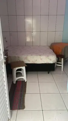 Uma cama ou camas num quarto em Trindade 06