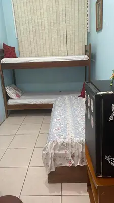 Uma cama ou camas num quarto em Trindade 06