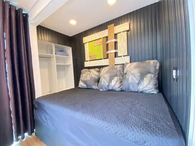Uma cama ou camas num quarto em Duplex com piscina na praia de Bombinhas