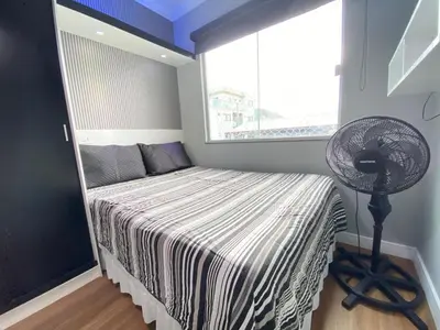 Uma cama ou camas num quarto em Duplex com piscina na praia de Bombinhas