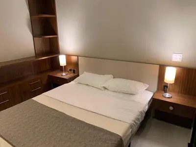 Uma cama ou camas num quarto em Cobertura pôr-do-sól com jacuzzi