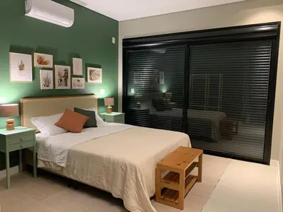 Uma cama ou camas num quarto em Cobertura pôr-do-sól com jacuzzi