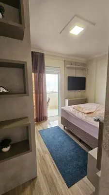 Uma cama ou camas num quarto em Falcão - 100 mts praia de Bombas