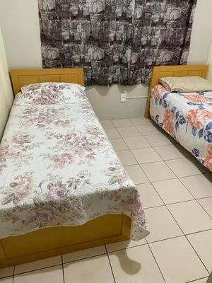 Uma cama ou camas num quarto em Ap pé na areia centro -10m da praia