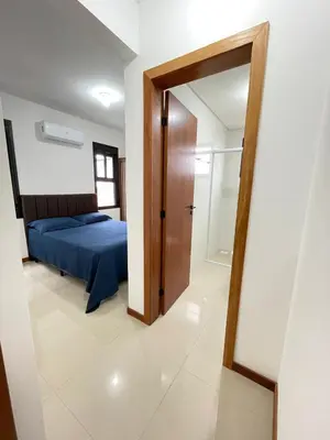 Uma cama ou camas num quarto em Ap na Praia de Palmas Gov Celso Ramos SC