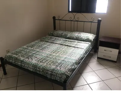 Uma cama ou camas num quarto em Pé na Areia! A melhor localização da praia!