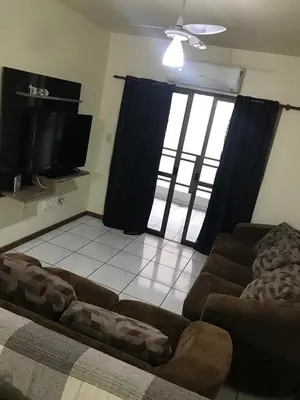 Uma televisão e/ou sistema de entretenimento em Apto em Itapema - Quadra MAR