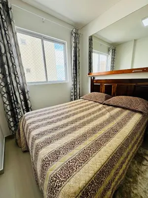 Uma cama ou camas num quarto em Mirante do mar
