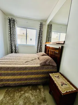 Uma cama ou camas num quarto em Mirante do mar