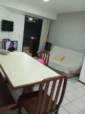 Uma televisão e/ou sistema de entretenimento em Apartamento Itapema