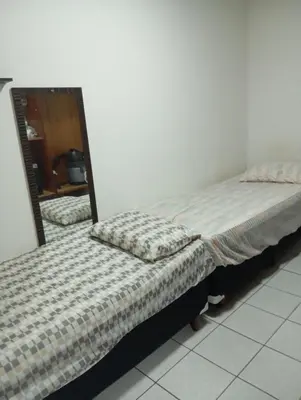 Uma cama ou camas num quarto em Apartamento Itapema