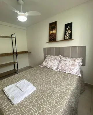 Uma cama ou camas num quarto em Apto no Caminho das Praias