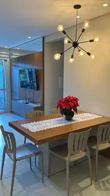 Uma televisão e/ou sistema de entretenimento em Apartamento praia de Palmas