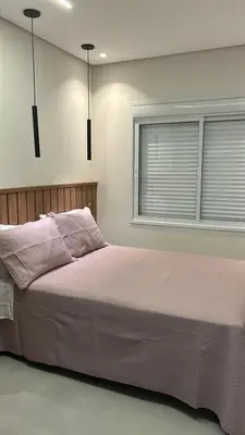 Uma cama ou camas num quarto em Apartamento praia de Palmas