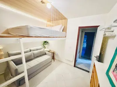 Uma cama ou camas num quarto em Residencial Solar das Bromelias Bombinhas ap120